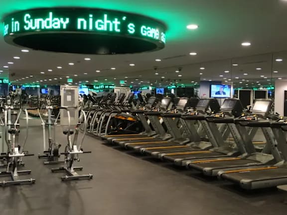 Fitness center with cardio machines and weight equipment at Torrey Gardens Apartments, California, 92130