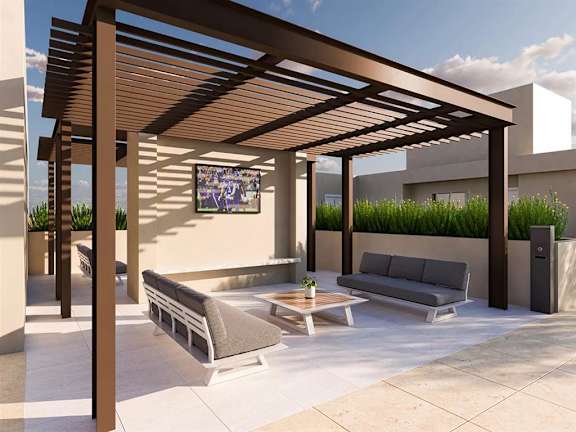 Rooftop lounge with pergola and outdoor tv at Garden at 3Roots Apartments, San Diego, 92126