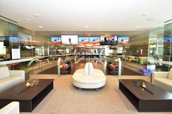 Private bowling alley with modern lounge area at 360 Luxury Apartments, California