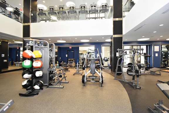 A gym with a variety of exercise equipment.
