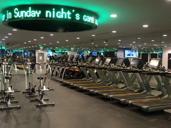 Fitness center with treadmills and elliptical machines at Torrey Gardens Apartments, California, 92130