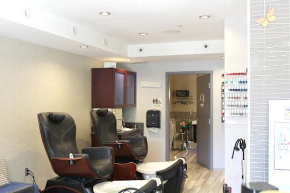 Nail salon pedicure station with massage chairs at Torrey Gardens Apartments, San Diego, 92130