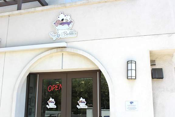 Pet grooming entrance with arched doorway at Torrey Gardens Apartments, San Diego, CA