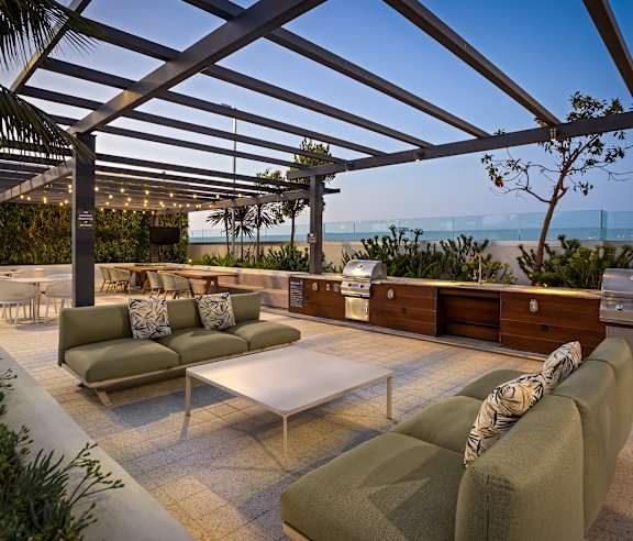 Rooftop lounge with built in outdoor kitchen and ocean views at Elements Apartments, Irvine, 92612