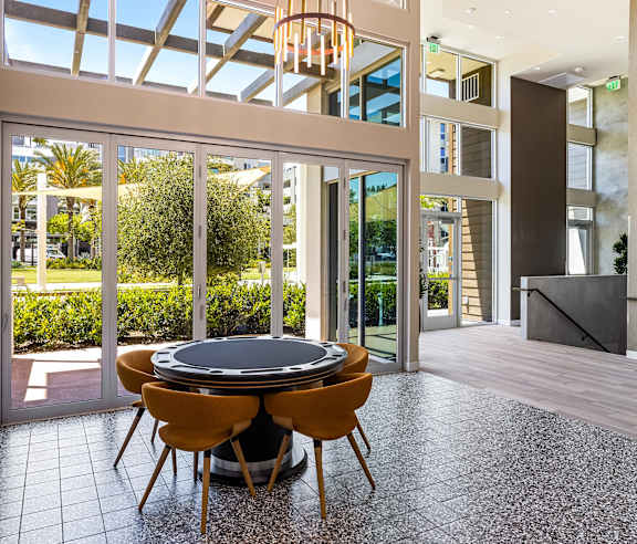 Game room with poker table and skylights at Elements Apartments, California
