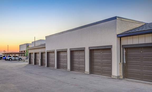 A building with a row of garage doors is shown.
