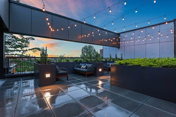 Open air sky deck with fire pit - Willow Apartments