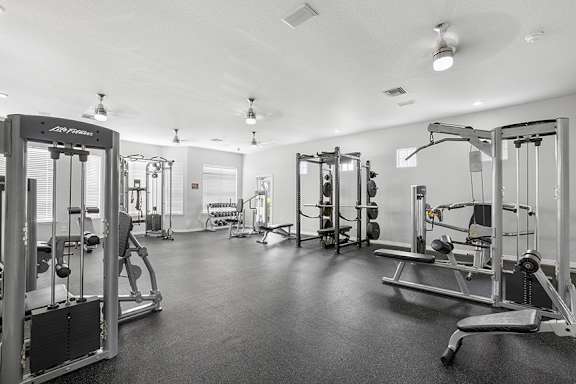 Innovative fitness center with strength training equipment - Egret's Landing Apartments