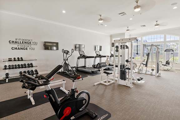 State-of-the-art fitness center with cardio machines - Courtney Station Apartments