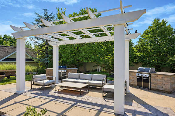 White pergola with built-in grills - Avenel at Montgomery Square