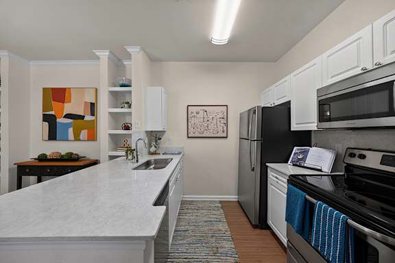 Stainless steel appliances with premium interior finishes - Belle Harbour Apartments