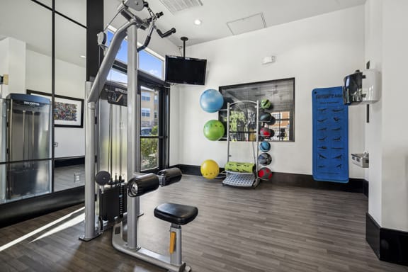 24-hour resident fitness center - Acadia at Cornerstar Apartments