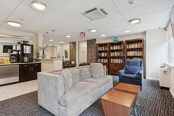 Library and Starbucks coffee available in resident lounge - Hill House at Chestnut HIll