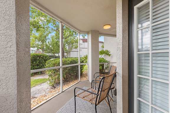 Expansive screened-in patios and balconies - Egret's Landing Apartments