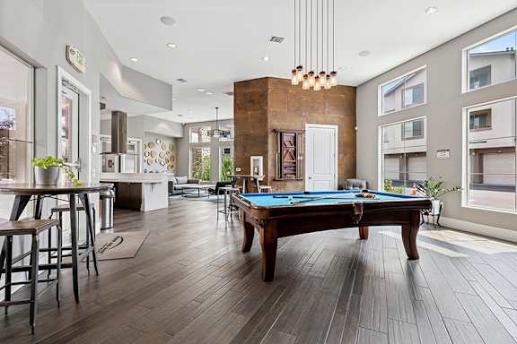 Fully-appointed clubhouse with billiards table - First and Main Apartments
