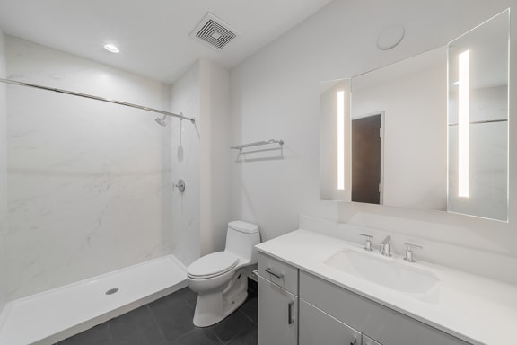 Bathroom with Quartz countertops and surrounds* - Maine 3 Downtown