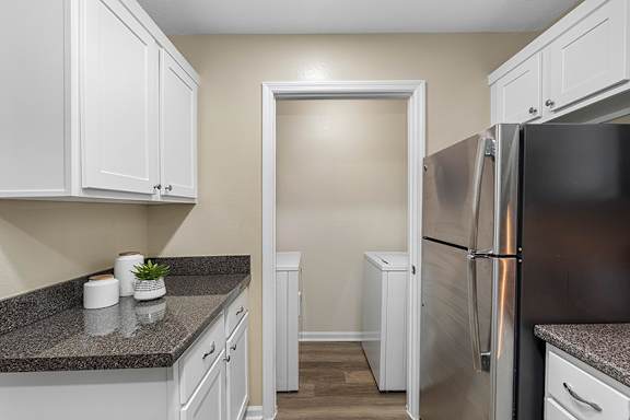 Washer/dryers in ever unit - The Colony at Deerwood Apartments