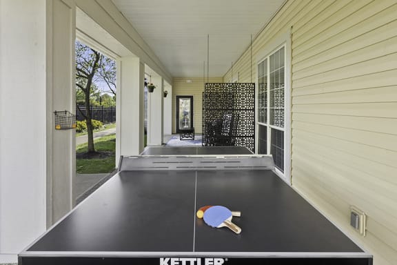Patio with ping pong table and lounge area - The Gardens at Polaris