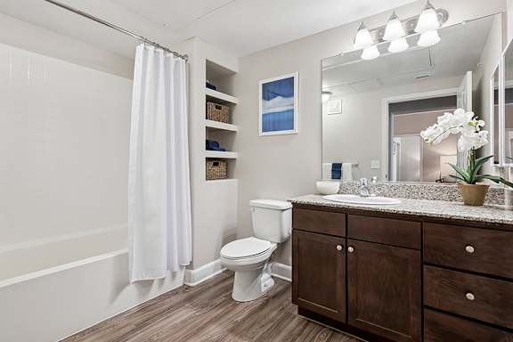 Wood-style flooring in bathrooms, kitchens and entryways - First and Main Apartments