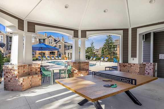 Poolside cabana with ping pong table - Lantern Woods Apartments