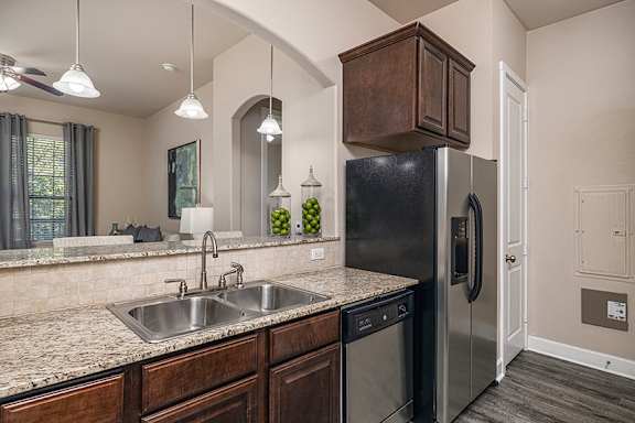 Side-by-side stainless steel refrigerators - Monterra Las Colinas Apartments