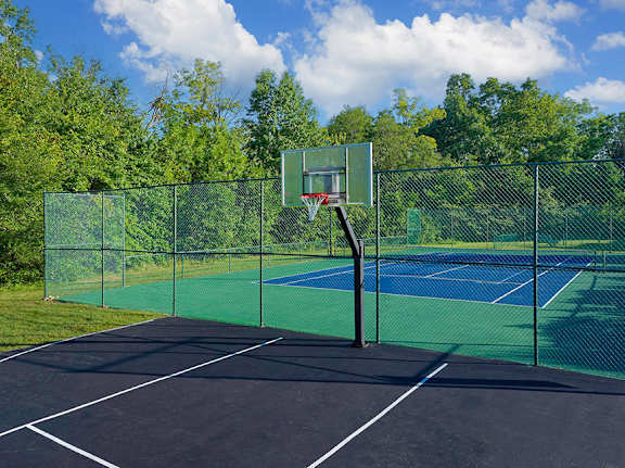 Sports court featuring tennis, basketball and pickleball - Lantern Woods Apartments