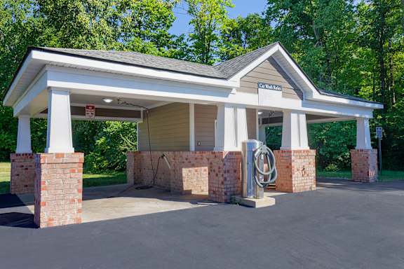 A covered parking area with a sign that says "Walden".