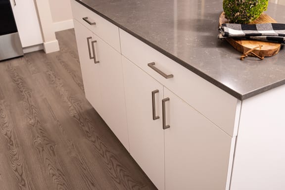 Wood-style flooring with carpeted bedrooms - NOVA at Green Valley