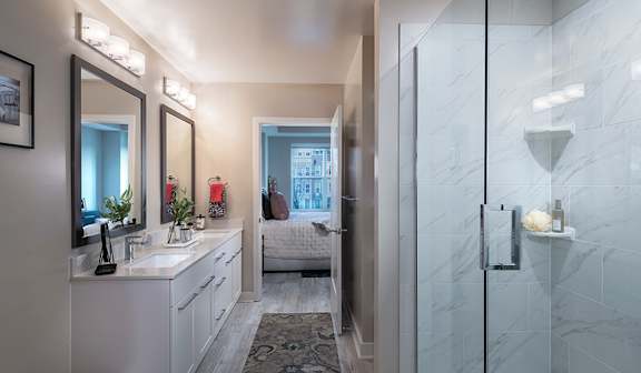 Expansive bathrooms with double vanities - Rockwell at Crown