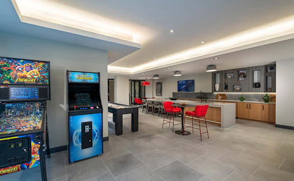 Game room with shuffleboard, ping pong, pinball and