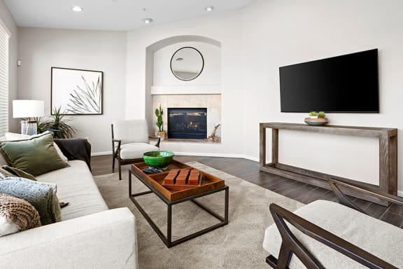 Ample seating and fireplace in the clubhouse - Arrowhead Landing