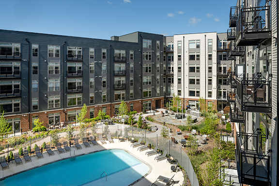 Two outdoor courtyards with fire pit lounge and games - Brentford at the Mile