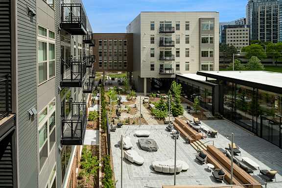 Two outdoor courtyards with fir epit and games - Brentford at the Mile
