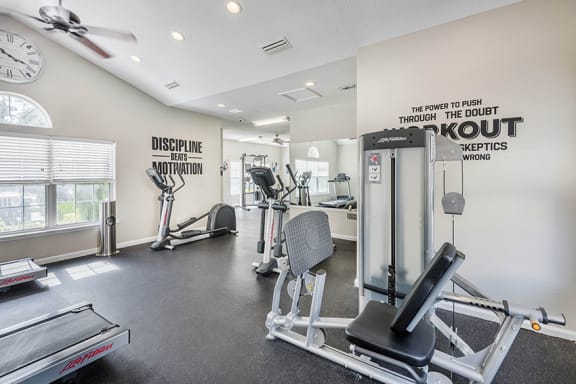 The Colony at Deerwood Apartments - Fitness center with cardio and weight training equipment