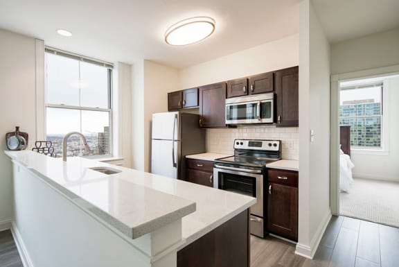 a kitchen with a large counter top and a sink