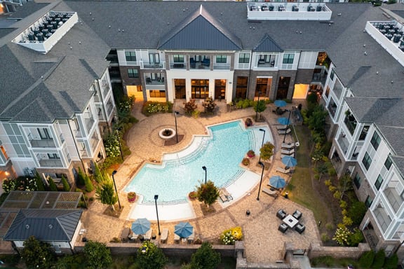 The Juncture Apartments resort-style pool with surrounding sundeck