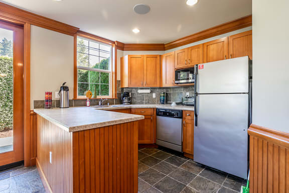 Clubhouse kitchen with stainless steel appliances - Springbrook Apartments
