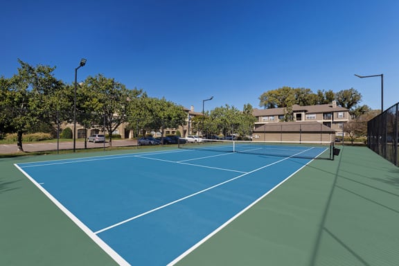 The Estates at River Pointe lighted tennis court
