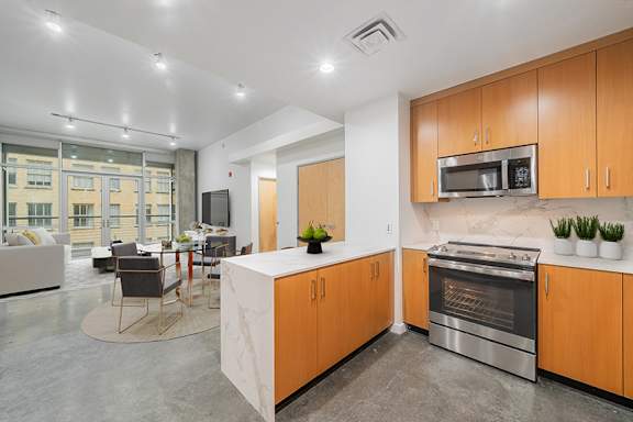 Quartz waterfall kitchen countertops in select units - Main 3 Downtown