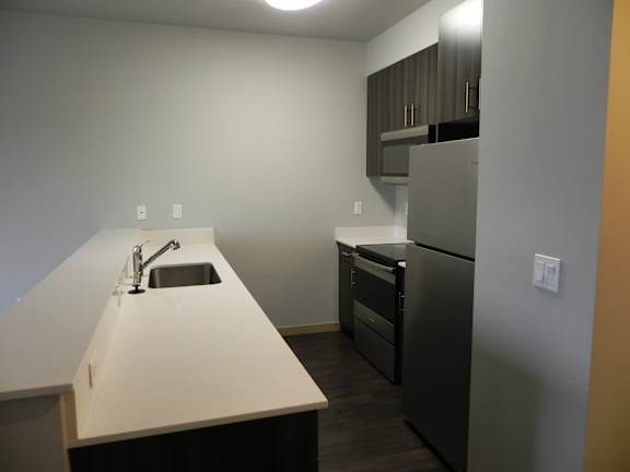 Kitchen with white countertops at The Charleston Port Orchard, Washington, 98366
