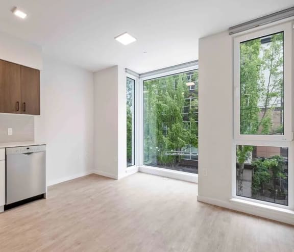 Large Open Space with Floor to Ceiling Windows at Ellie Passivhaus in Uptown Seattle, WA