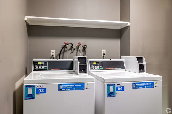 Two AT&T branded machines are on a shelf.