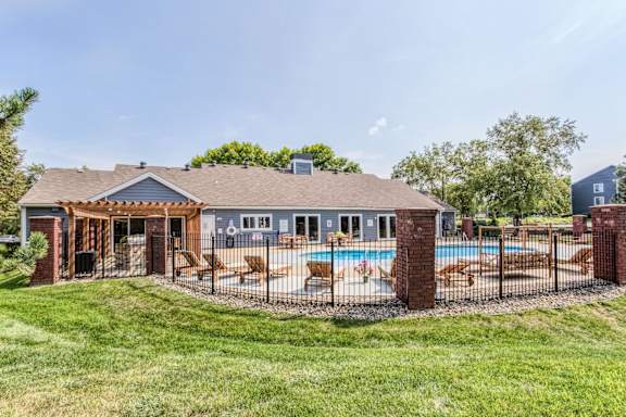 A house with a pool and a covered patio.