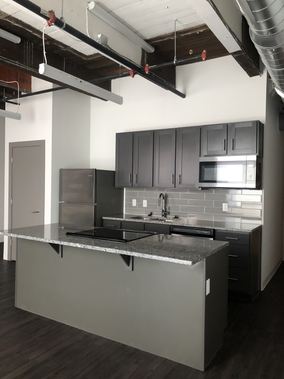 a view of the kitchen from the top of the stairs