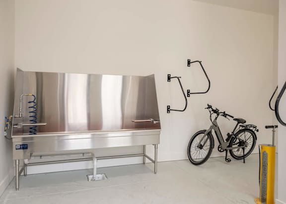A bike is parked next to a metal table.