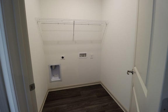 a small bathroom with a small toilet and a small sink at The Crest at Acworth, Acworth, GA