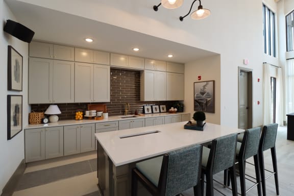 a large white kitchen with a large island at The Crest at Acworth, Acworth, GA