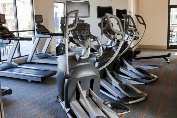 a row of exercise machines in a gym at The Crest at Laurel Canyon, Georgia, 30114