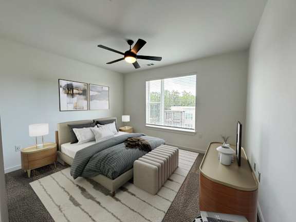 A bedroom with a bed, nightstand, and a window with blinds.