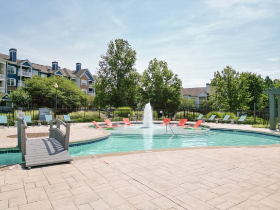 the preserve at ballantyne commons pool with chairs and water fountain